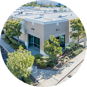 Single-story retail space surrounded by trees and landscaped pathways, emphasizing accessible and practical areas